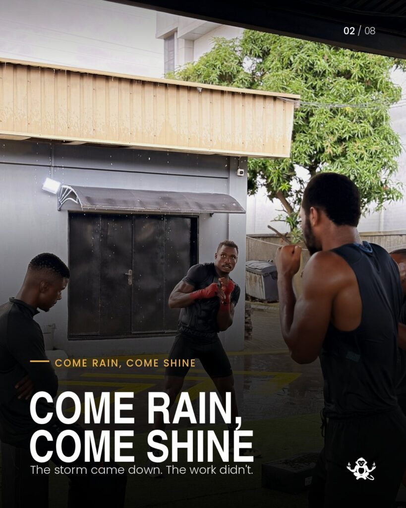 Zodsolo shadow boxes with his team during training in the rain, in an AfroAlien Fit "Come rain, come shine" graphic.
